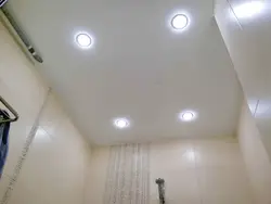 Spotlight in a plastic ceiling in the bathroom photo