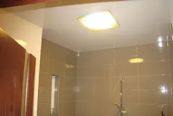 Spotlight in a plastic ceiling in the bathroom photo