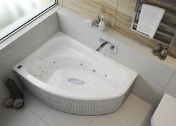 Bathtub with asymmetrical bathtub photo