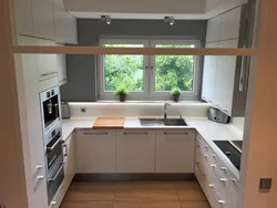 Kitchen design in a house with a 12 sq. m window