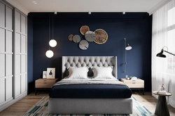 Bedroom with dark blue wallpaper photo