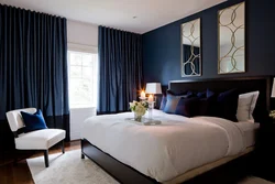 Bedroom with dark blue wallpaper photo