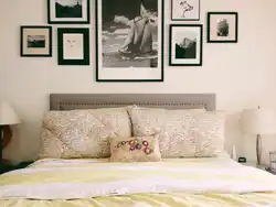 Paintings on the wall in the bedroom above the bed photo