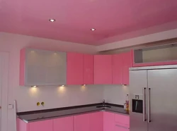 What color is the ceiling in the kitchen photo