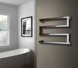 Heated towel rail in the bathroom photo