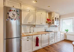Kitchen with gold refrigerator photo