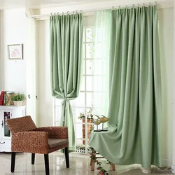 Photo of green curtains in the living room interior photo