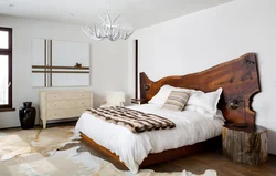 Wooden bed in the bedroom interior photo