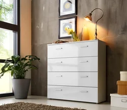 White chests of drawers in the living room interior