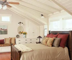 Bedroom Design With A Sloping Ceiling In A Wooden House