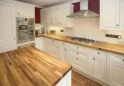 Photo of a kitchen with a wood-colored countertop