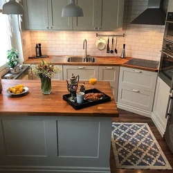 Photo of a kitchen with a wood-colored countertop