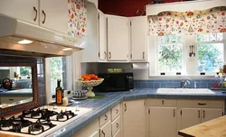 Kitchen design in a house with two windows on one wall