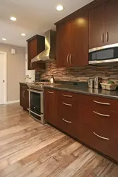 Brown kitchen in the interior photo small