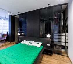 Bedroom design with dressing room behind the bed