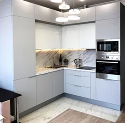 Kitchen interior with white glossy furniture