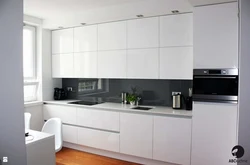 Kitchen interior with white glossy furniture