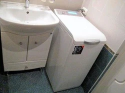 Vertical Washing Machine In The Bathroom Interior