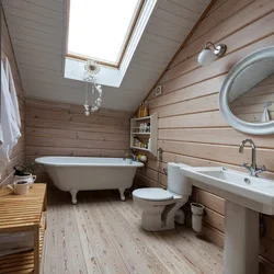 Design of a bath with toilet in a wooden house photo
