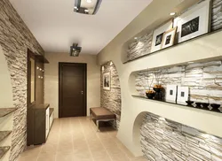 Decorative stone in the interior with hallway wallpaper