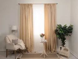 What color of curtains will go with beige wallpaper in the living room photo
