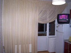 Photo of a curtain for the kitchen with a balcony door