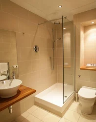 Small combined bathroom with shower photo