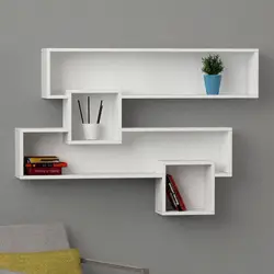 Modern shelves on the wall in the bedroom photo