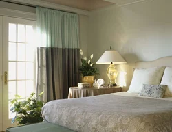 Curtains in the interior of a small bedroom photo