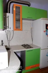 Kitchen with a heater and a refrigerator in Khrushchev real photos