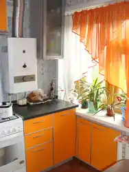 Kitchen with a heater and a refrigerator in Khrushchev real photos