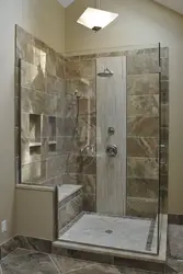 Shower in a bathroom without a cubicle made of tiles photo