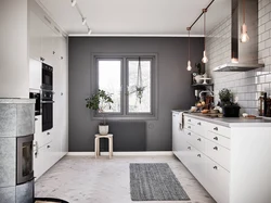 Gray kitchen in the interior combination with wallpaper