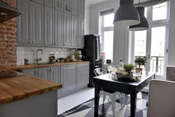 Gray kitchen in the interior combination with wallpaper