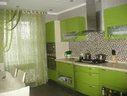 Light green curtains in the kitchen interior