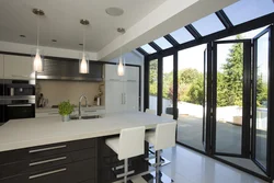 Kitchen with panoramic window in apartment photo design