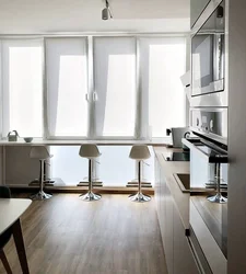 Kitchen with panoramic window in apartment photo design