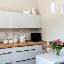 Combination of white kitchen with wallpaper photo