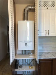 Photo of a kitchen in a house with a boiler on the wall