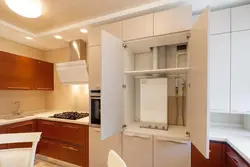 Photo of a kitchen in a house with a boiler on the wall