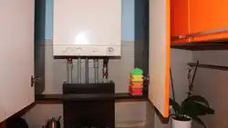 Photo of a kitchen in a house with a boiler on the wall