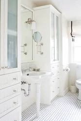 White furniture in the bathroom interior