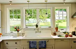 Kitchen design in a country house with a large window