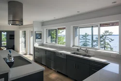 Kitchen design in a country house with a large window