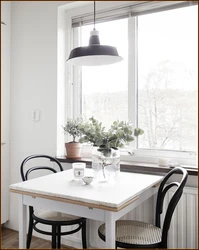 Kitchen table by the window photo design