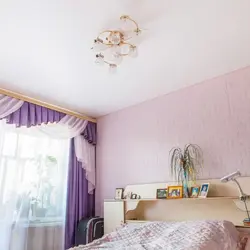 Photo of suspended ceilings in a white bedroom