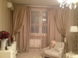 Milky curtains in the living room interior