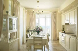 Kitchen design with a window and access to the terrace photo