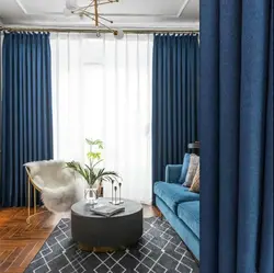 Blue curtains in the living room interior