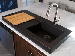 Black sink in the kitchen interior